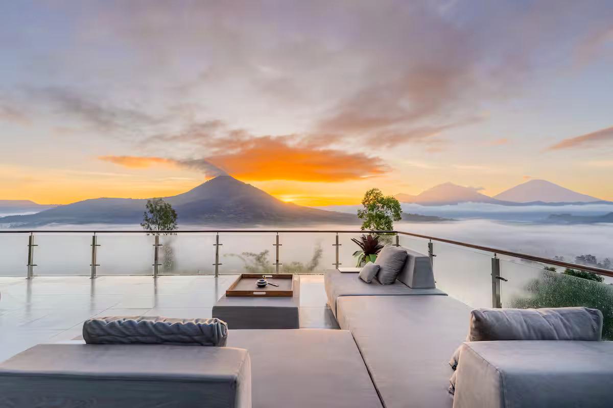 Bali villa terrace at sunrise with volcano view