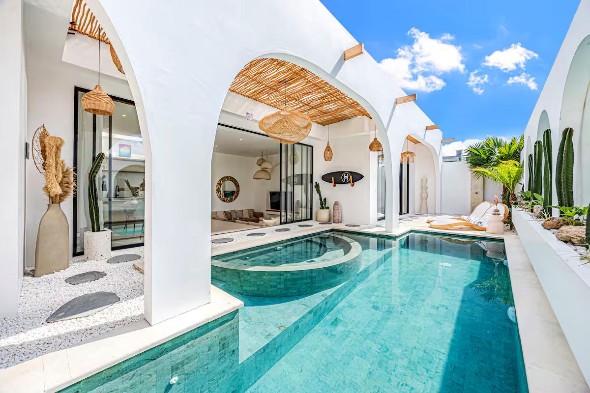 White arched villa with turquoise pool in Bali