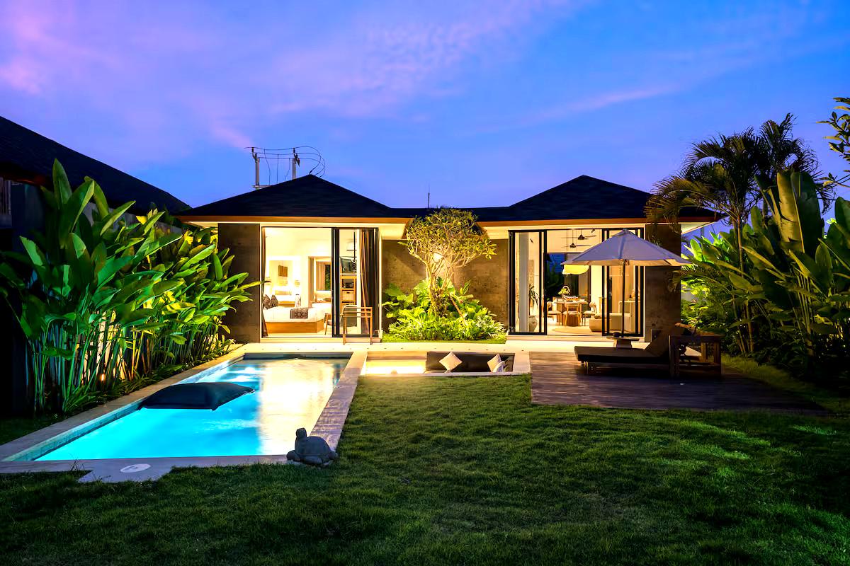 Bali villa garden and pool at twilight